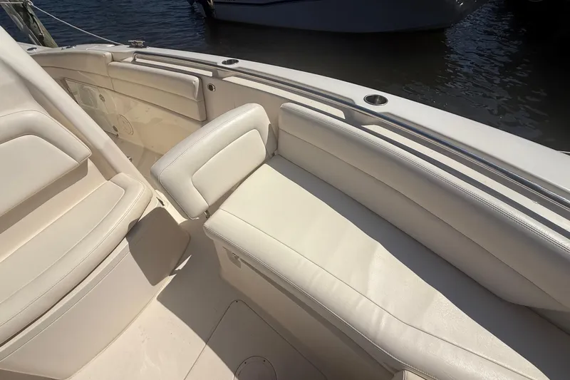  Yacht Photos Pics 2017 Grady-White Canyon 271 FS boat interior with white cushioned seating.