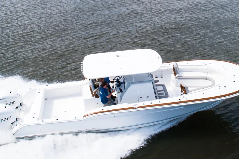  Yacht Photos Pics 2019 Buddy Davis 34 Center Console boat cruising on open water.