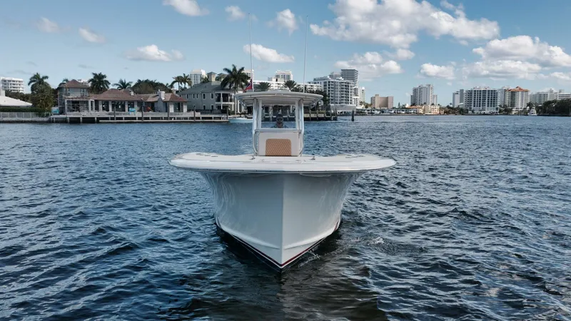 Seabae Yacht Photos Pics 2019 Custom Carolina 30 Open boat on water, city skyline in background.