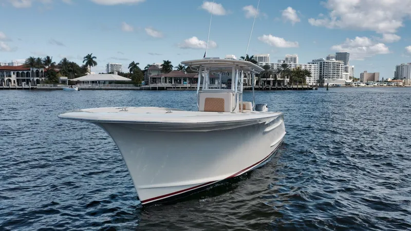 Seabae Yacht Photos Pics 2019 Custom Carolina 30 Open boat on water, cityscape background, clear sky.