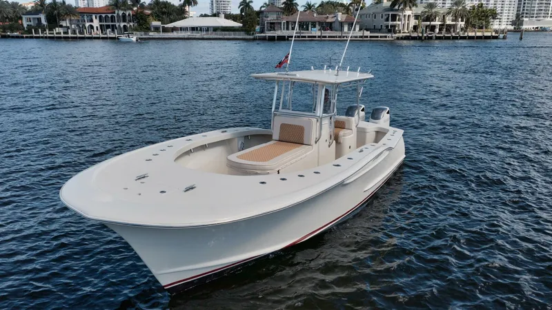 Seabae Yacht Photos Pics 2019 Custom Carolina 30 Open boat on water, luxury waterfront homes in background.