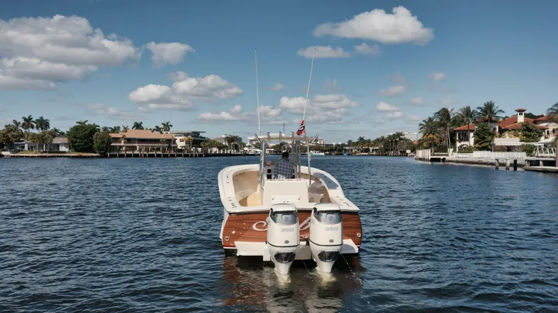 Seabae Yacht Photos Pics 2019 Custom Carolina 30 Open boat on a scenic waterway with clear skies.