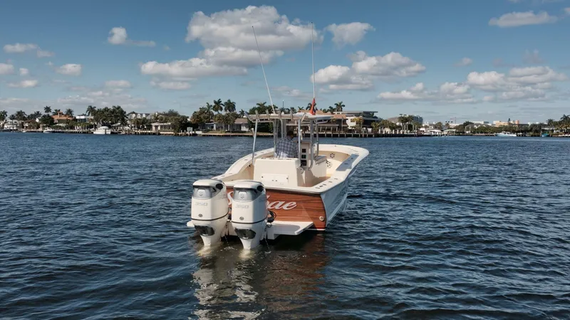 Seabae Yacht Photos Pics 2019 Custom Carolina 30 Open boat on calm water, featuring dual outboard engines.
