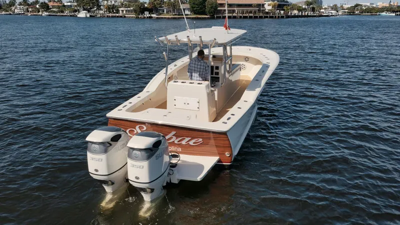 Seabae Yacht Photos Pics 2019 Custom Carolina 30 Open boat with dual engines on a calm waterway.
