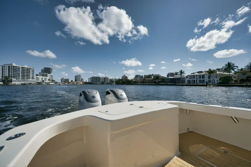 Seabae Yacht Photos Pics 2019 Custom Carolina 30 Open boat on water, city skyline in background.