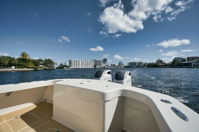 Seabae Yacht Photos Pics 2019 Custom Carolina 30 Open boat on water with city skyline in background.