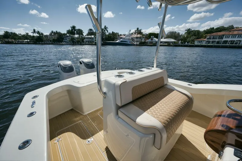 Seabae Yacht Photos Pics 2019 Custom Carolina 30 Open boat interior with seating, on a sunny waterfront.