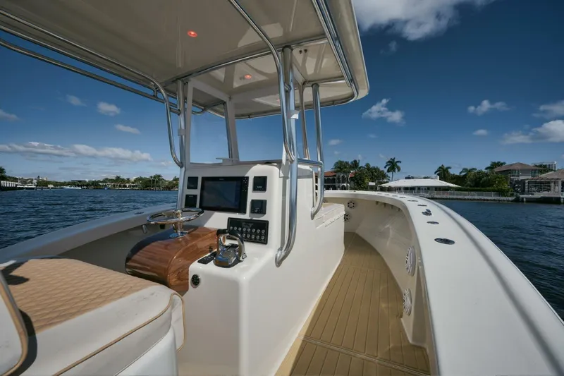 Seabae Yacht Photos Pics 2019 Custom Carolina 30 Open boat interior with helm, on a sunny day.