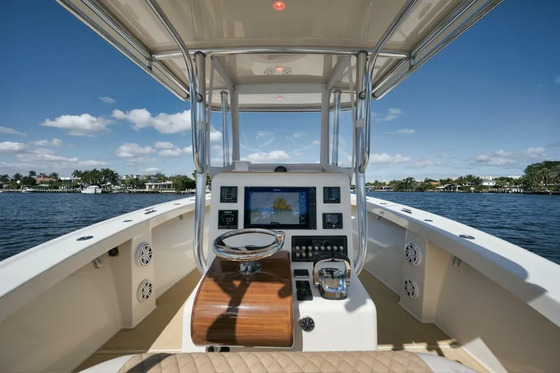 Seabae Yacht Photos Pics 2019 Custom Carolina 30 Open boat interior with steering wheel and navigation system.