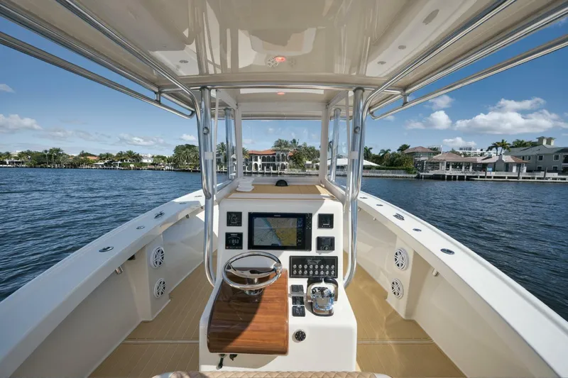 Seabae Yacht Photos Pics 2019 Custom Carolina 30 Open boat cockpit with navigation system on a sunny day.