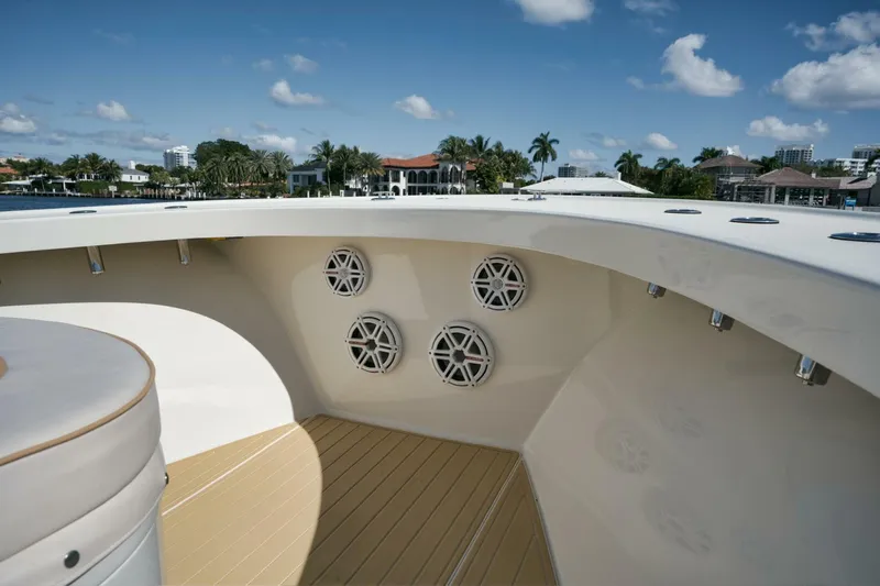 Seabae Yacht Photos Pics 2019 Custom Carolina 30 Open boat deck with speakers, under a clear blue sky.