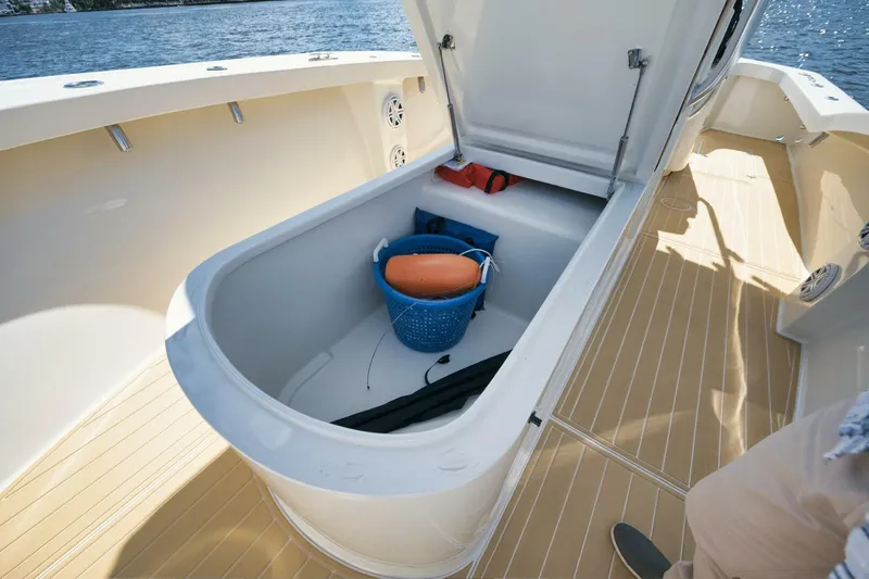 Seabae Yacht Photos Pics 2019 Custom Carolina 30 Open boat storage compartment with gear and accessories.