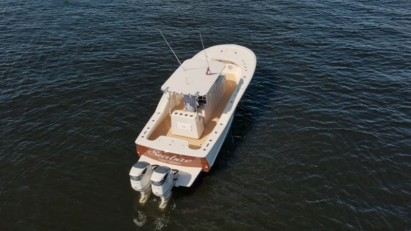Seabae Yacht Photos Pics 2019 Custom Carolina 30 Open boat on water with twin engines.
