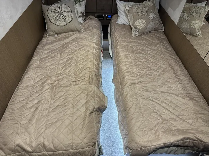  Yacht Photos Pics Twin beds in 2019 Galeon 650 Sky yacht cabin with beige bedding and decorative pillows.