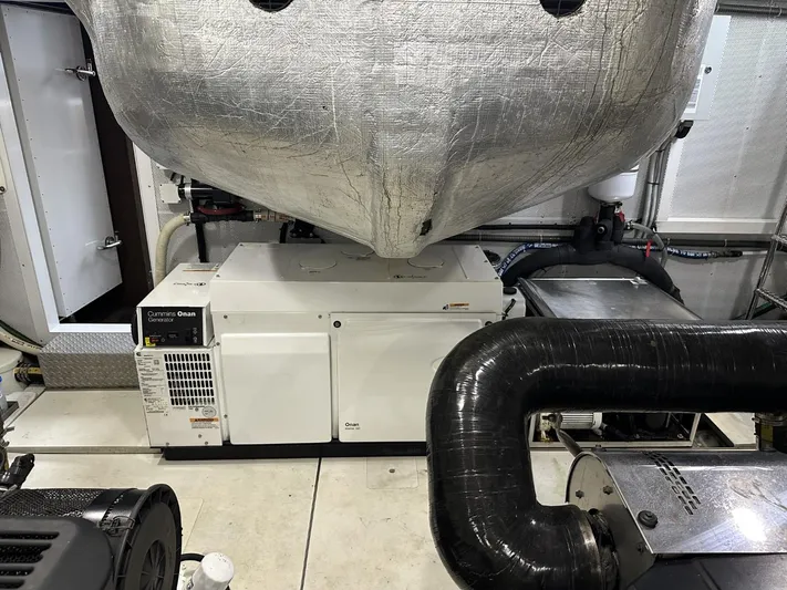  Yacht Photos Pics Engine room of 2019 Galeon 650 Sky yacht, featuring generator and machinery.