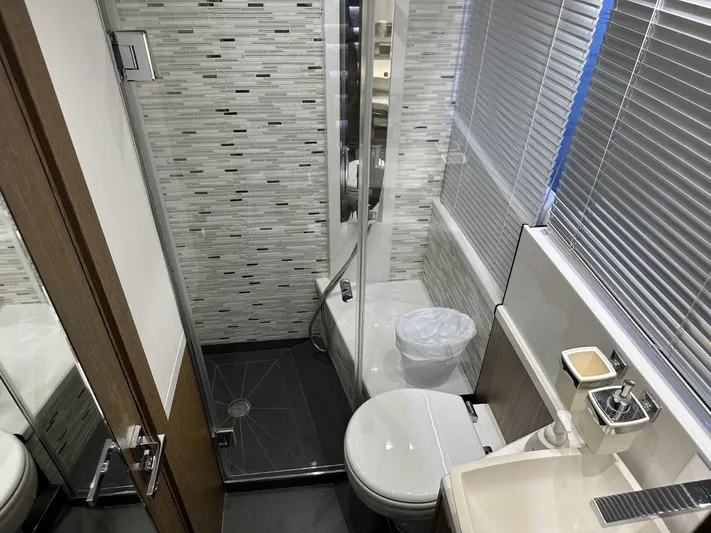  Yacht Photos Pics Luxurious bathroom in 2019 Galeon 650 Sky yacht with modern fixtures and sleek design.