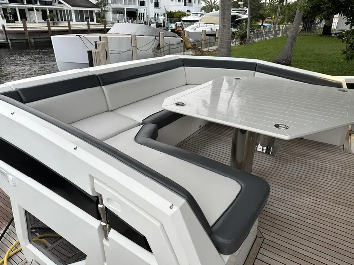  Yacht Photos Pics Spacious seating area on 2019 Galeon 650 Sky yacht with sleek table and modern design.