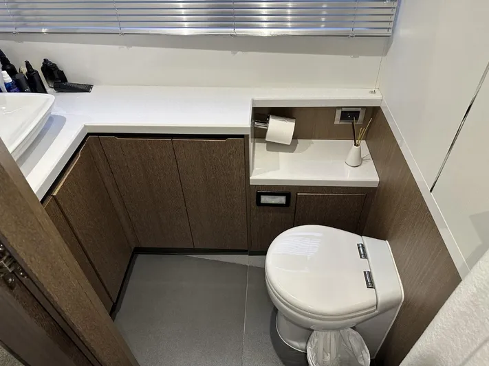  Yacht Photos Pics Modern bathroom in 2019 Galeon 650 Sky yacht with sleek fixtures and wood cabinetry.