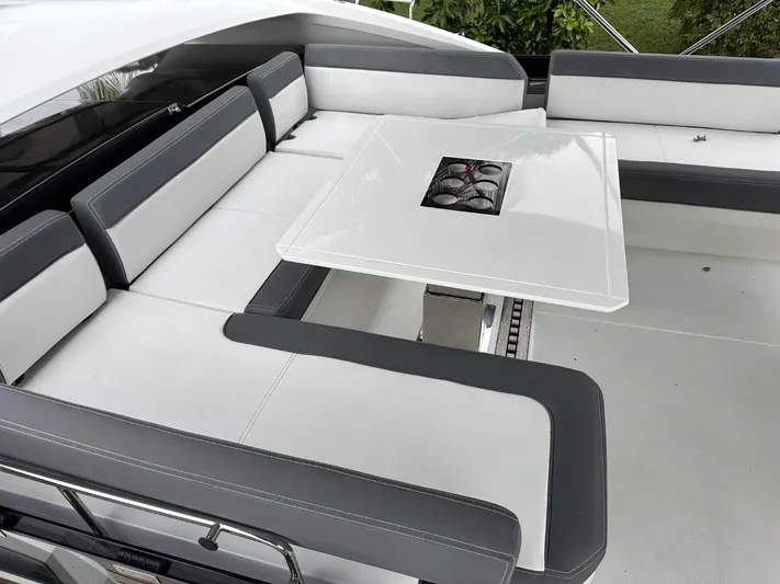 Yacht Photos Pics Luxurious seating area on 2019 Galeon 650 Sky yacht with sleek white and gray design.