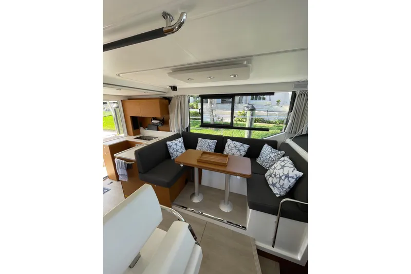  Yacht Photos Pics Interior of 2025 Beneteau Swift Trawler 41 Fly with modern seating and dining area.