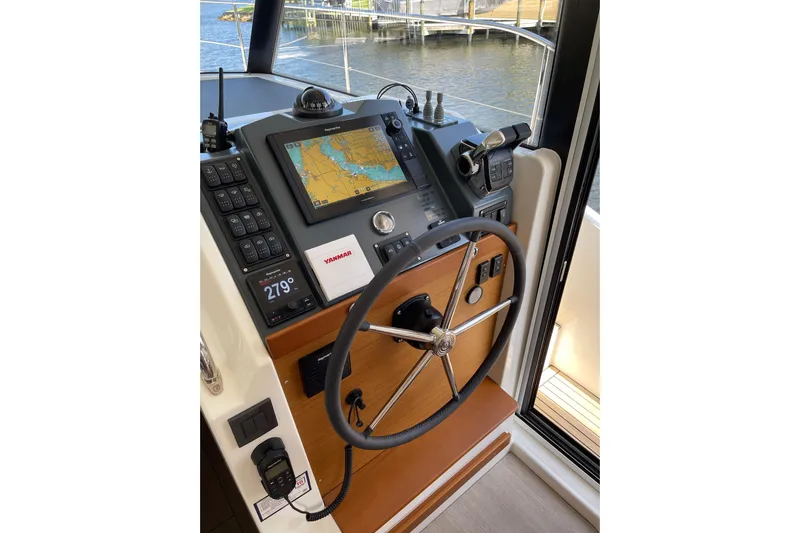 Yacht Photos Pics Helm of 2025 Beneteau Swift Trawler 41 Fly with navigation controls and display.