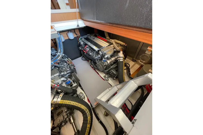  Yacht Photos Pics Engine room of 2025 Beneteau Swift Trawler 41 Fly, showcasing dual engines and components.