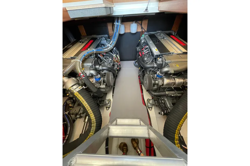  Yacht Photos Pics Engine room of 2025 Beneteau Swift Trawler 41 Fly, showcasing dual engines and mechanical components.