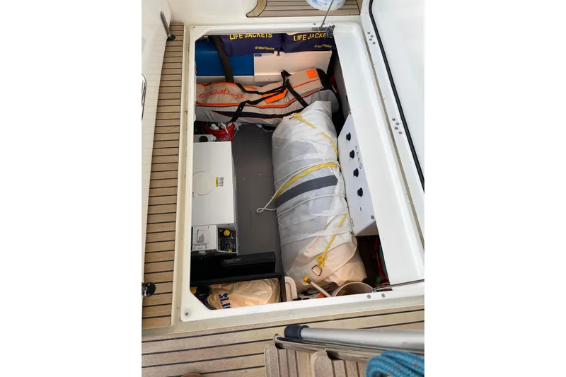  Yacht Photos Pics Storage compartment of 2025 Beneteau Swift Trawler 41 Fly with life jackets and equipment.