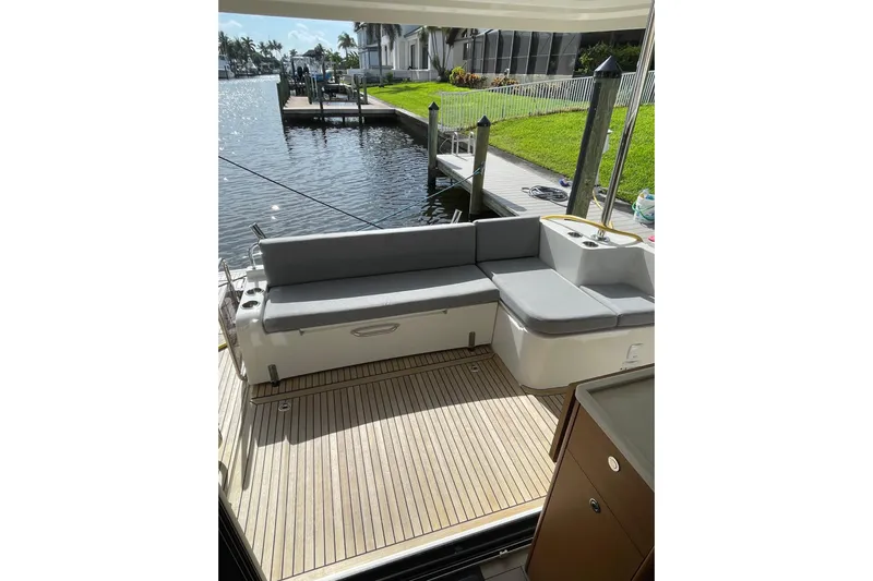  Yacht Photos Pics 2025 Beneteau Swift Trawler 41 Fly deck with seating, dockside view.