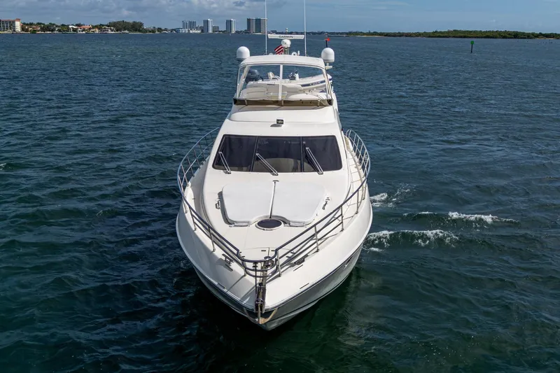 To Life! Yacht Photos Pics 2005 Azimut Fly 62 yacht cruising on open water, front view.