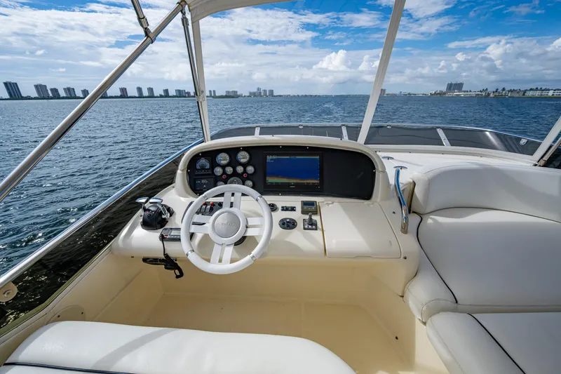 To Life! Yacht Photos Pics 2005 Azimut Fly 62 yacht helm with ocean view and modern navigation controls.