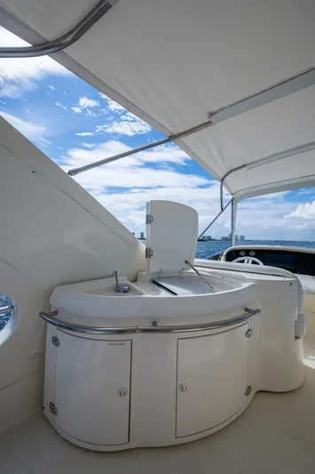 To Life! Yacht Photos Pics 2005 Azimut Fly 62 yacht deck with sleek white cabinetry and ocean view.