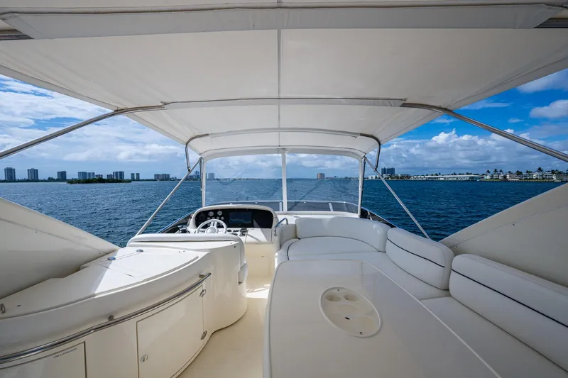 To Life! Yacht Photos Pics Luxurious 2005 Azimut Fly 62 yacht interior with ocean view and modern seating.