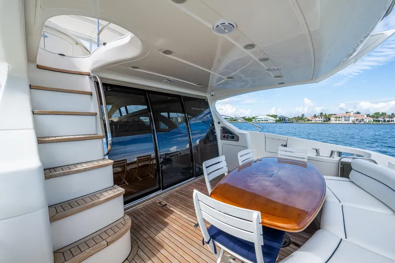 To Life! Yacht Photos Pics Luxurious 2005 Azimut Fly 62 yacht deck with elegant seating and ocean view.