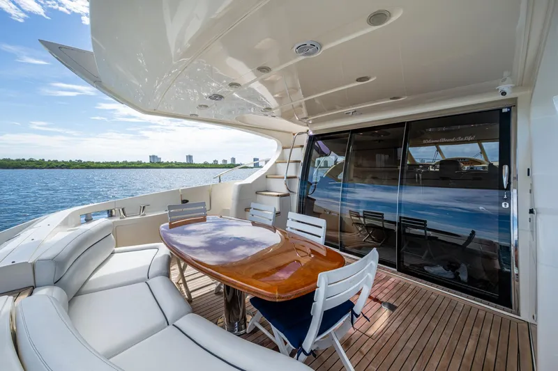 To Life! Yacht Photos Pics Luxurious 2005 Azimut Fly 62 yacht deck with elegant seating and ocean view.