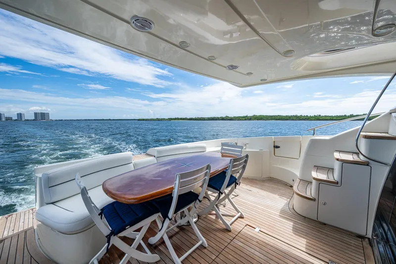 To Life! Yacht Photos Pics Luxurious 2005 Azimut Fly 62 yacht deck with elegant seating and ocean view.