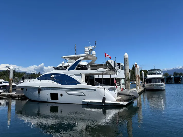 Skye Yacht Photos Pics 2019 Azimut Fly 50 yacht docked at marina under clear blue sky.