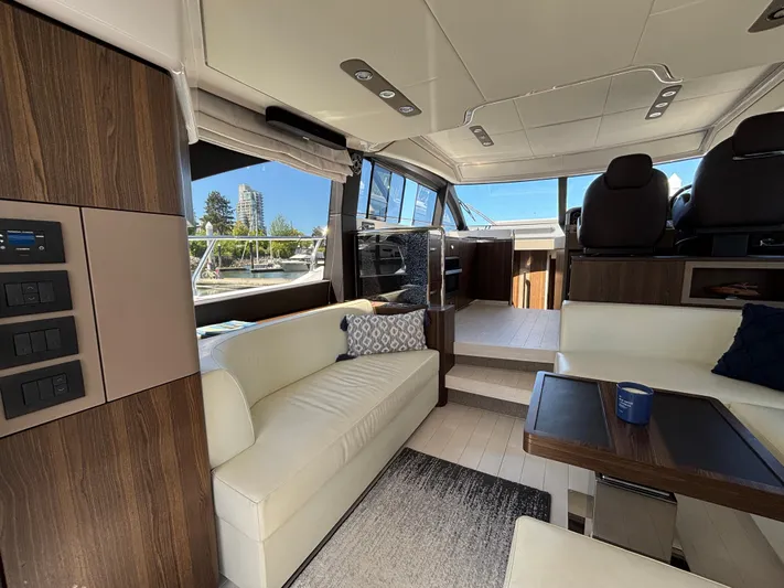 Skye Yacht Photos Pics Luxurious interior of 2019 Azimut Fly 50 yacht with modern seating and scenic views.