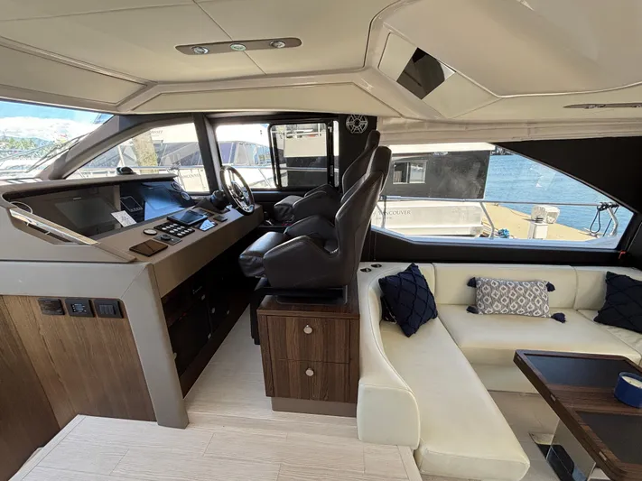 Skye Yacht Photos Pics Luxurious interior of 2019 Azimut Fly 50 yacht with modern helm and seating area.