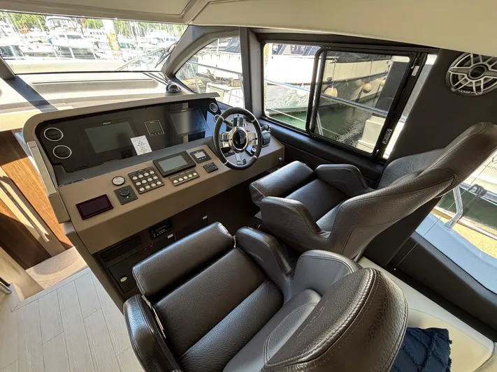 Skye Yacht Photos Pics 2019 Azimut Fly 50 yacht helm with modern controls and leather seating.