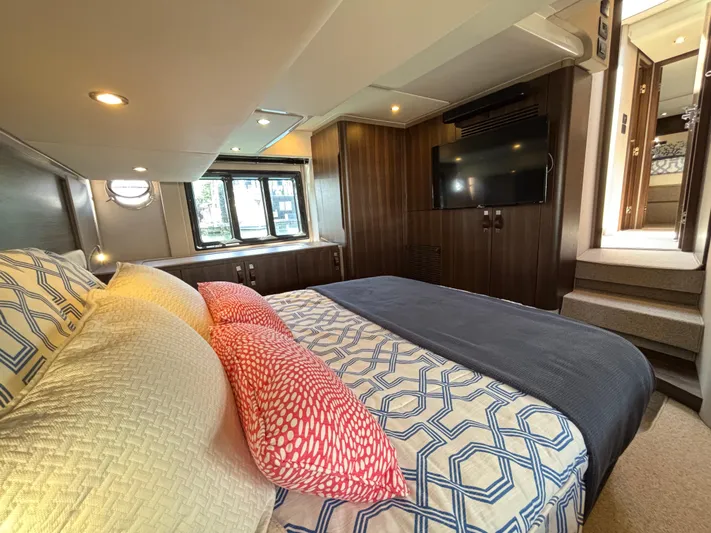 Skye Yacht Photos Pics Luxurious bedroom interior of 2019 Azimut Fly 50 yacht with modern decor and cozy bedding.