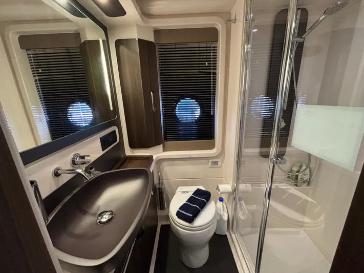 Skye Yacht Photos Pics Luxurious bathroom in 2019 Azimut Fly 50 yacht with modern fixtures and elegant design.
