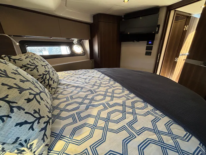 Skye Yacht Photos Pics Luxurious bedroom interior of 2019 Azimut Fly 50 yacht with patterned bedding and modern decor.