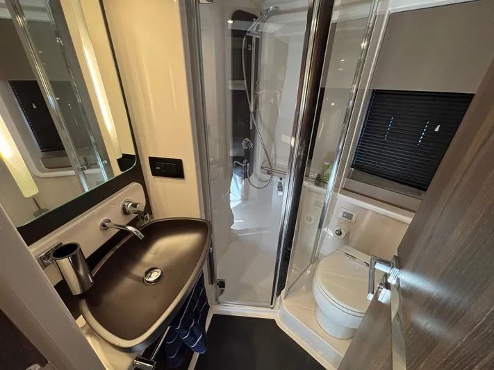 Skye Yacht Photos Pics Luxurious bathroom in 2019 Azimut Fly 50 yacht with modern fixtures and shower.