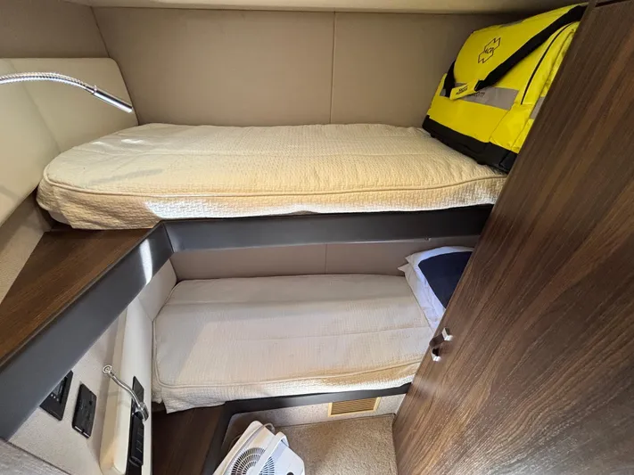 Skye Yacht Photos Pics 2019 Azimut Fly 50 yacht cabin with bunk beds and storage.