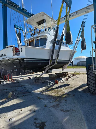 Bad To The Bone Yacht Photos Pics 1995 Egg Harbor Golden Egg 42 yacht lifted by crane for maintenance.