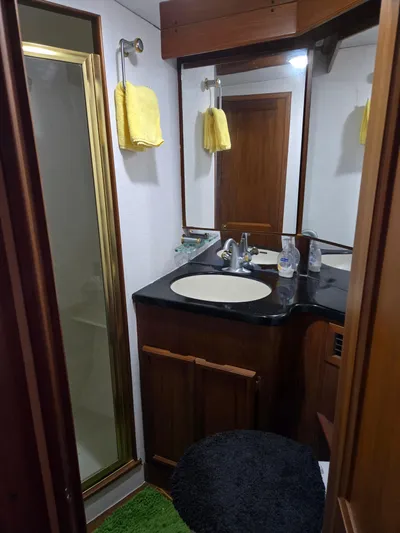Bad To The Bone Yacht Photos Pics Bathroom interior of 1995 Egg Harbor Golden Egg 42 yacht with shower and sink.
