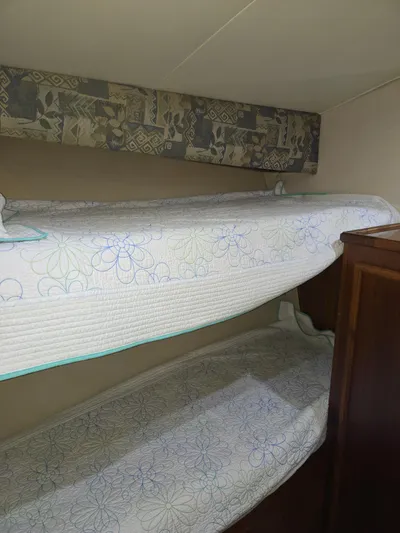 Bad To The Bone Yacht Photos Pics Bunk beds in 1995 Egg Harbor Golden Egg 42 yacht cabin, floral bedding.
