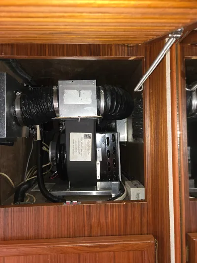 Bad To The Bone Yacht Photos Pics Engine compartment of a 1995 Egg Harbor Golden Egg 42 boat, featuring mechanical components.