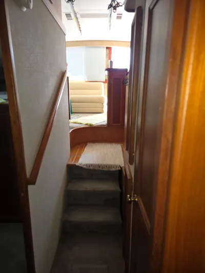 Bad To The Bone Yacht Photos Pics Interior of 1995 Egg Harbor Golden Egg 42 yacht, featuring a cozy hallway and stairs.